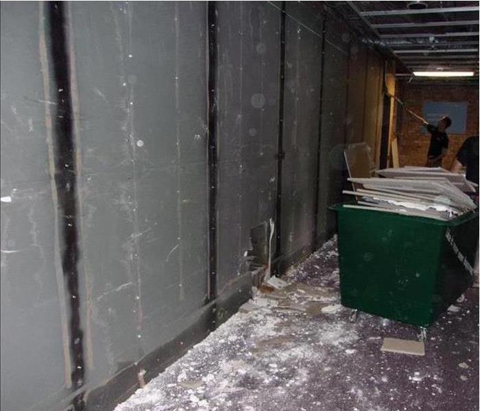 poly sheets, drywall demolished in dumpster