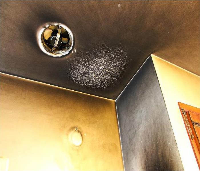 Bubbled and smoked up ceiling after a kitchen fire
