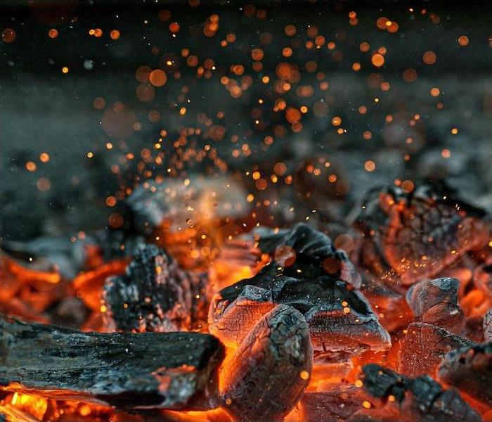 hot coals burning in a campfire
