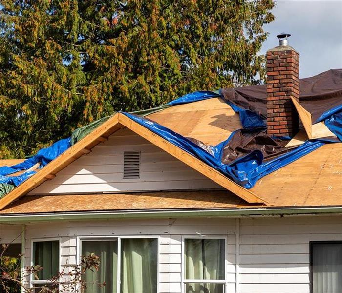 A roof is damaged after a storm